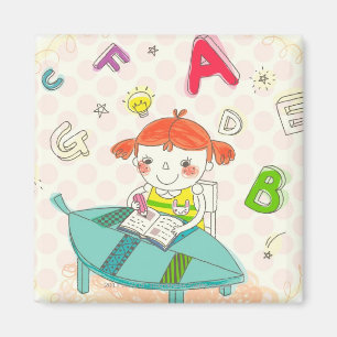 Mädchen sitzt auf dem Stuhl und lernt Magnet