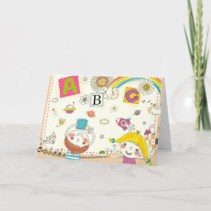 Mädchen und Junge spielen an der Tafel Karte