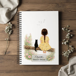 Mädchen und schwarze Katze auf einem Ast Notizbuch