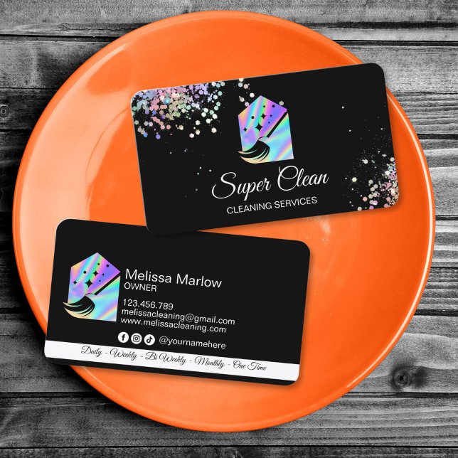 Maid Cleaning House Holographic Sparkling Business Visitenkarte (holographic cleaning logo with a house and a broom, glitter details, black background business card)