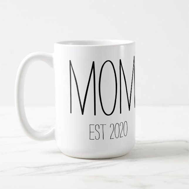 Mama-Tasse mit EST Kaffeetasse (Links)