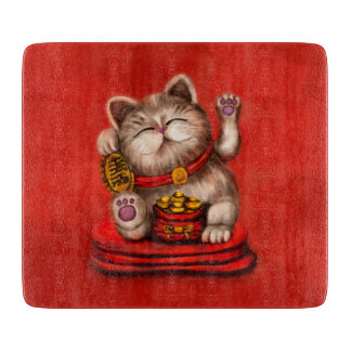 Maneki-neko Katzensprung auf Rot Schneidebrett