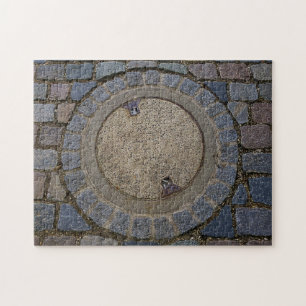 Manhole-Abdeckung und Kopfsteinpflasterstraße Puzzle