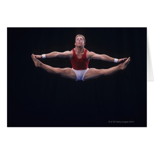 Männlicher Gymnastiker darstellend auf der Bodenüb (Vorderseite (Horizontal))