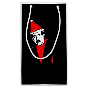 Manos bringt kleine Vorlagengeschenk-Tasche zurüc Geschenktüte