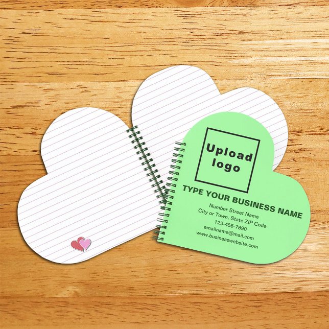 Markenbezeichnung für hellgrüne Herzform Spirale Notizbuch (Build brand name awareness. Your business brand on light green heart shape spiral notebook.)