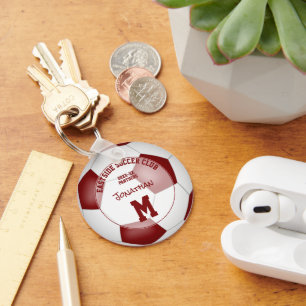 Maroon White Soccer-Team schenkt Kindersport Schlüsselanhänger
