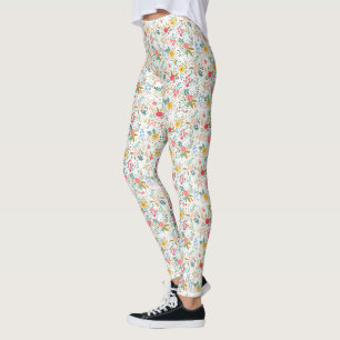 Mehrfarbige Frühlingsblumenmuster auf weißem Hinte Leggings