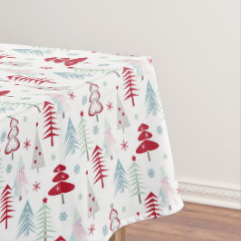 mehrfarbige Weihnachtsbäume auf einem weißen Tischdecke