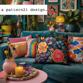 Melancholische mehrfarbige Blüten auf schwarzem Mu Kissen