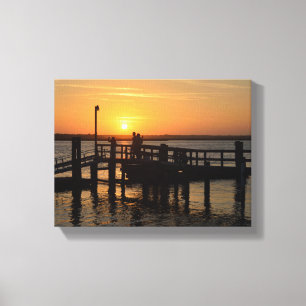 Menschen Silhouette auf einem Pier bei Sonnenunter Leinwanddruck