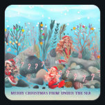 Mermaid Christmas Quadratischer Aufkleber<br><div class="desc">Mermaids feiern Weihnachten mit Süßigkeiten und bunten Glühbirnen unter dem Meer.</div>
