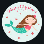 Mermaid Christmas Red Aqua Runder Aufkleber<br><div class="desc">Die Weihnachtsaufkleber der Meerjungfrau zeichnen sich durch ein niedliches Meerjungfrau- und Seesterndesign aus. Weitere passende Artikel sind ebenfalls verfügbar.</div>