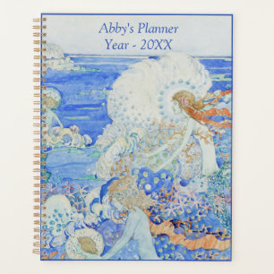 Mermaids spielen im Planer der blauen Waves