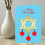 Merry Chrismukkah Intertrust Holiday Card Feiertagskarte<br><div class="desc">Diese Urlaubskarte kombiniert zwei Feiertage Weihnachten und Hanukkah. Das Design präsentiert den Star of David auf einem blauen Hintergrund mit drei roten Weihnachtsschmuckstücken,  die daran hängen. Die Worte "Fröhliche Chrismukka" erscheinen oben. Dies ist eine großartige Möglichkeit,  zwei Ferien auf einmal zu feiern. Copyright Kathy Henis</div>