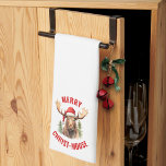 Merry Christ-moose Funny Christmas Moose Geschirrtuch<br><div class="desc">Genießen Sie den Urlaubssinn mit unserem charmanten Weihnachtsküchentuch, das von einem lieblichen Elch an einer Weihnachtsmannmütze auf der Vorderseite begleitet wird, begleitet von dem sonnigen Gruß "Fröhlicher Christ-Elch". Dieses Handtuch eignet sich ideal, um während der Festsaison Lachen und Freude zu verbreiten. Das skurrile Design und das clevere Wortspiel machen es...</div>