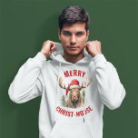 Merry Christ-moose Funny Christmas Moose Hoodie<br><div class="desc">Genießen Sie den Urlaubssinn mit unserem charmanten Weihnachtshaus, das mit einem lieblichen Elch an einer Weihnachtsmannmütze vorne liegt, begleitet von der sonnigen Begrüßung "Fröhlicher Christ-Elch". Diese Kapelle ist ideal, um während der Festsaison Lachen und Freude zu verbreiten. Das skurrile Design und das clevere Wortspiel machen es zu einer einzigartigen und...</div>