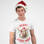 Merry Christ-moose Funny Christmas Moose T-Shirt<br><div class="desc">Genießen Sie den Urlaubssgeist mit unserem zauberhaften Weihnachtsfest-T - Shirt, mit einem lieblichen Elch, der eine Weihnachtsmannmütze vorne spielt, begleitet von dem sonnigen Gruß "Fröhlicher Christ-Elch". Dieses Shirt eignet sich hervorragend, um Lachen und Freude während der Festsaison zu verbreiten. Das skurrile Design und das clevere Wortspiel machen es zu einer...</div>