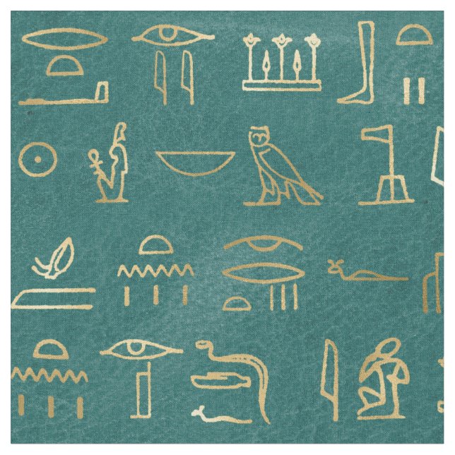 Metallische ägyptische Hieroglyphen auf Grün Stoff (Nahaufnahme)