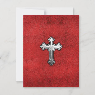Metallkreuz auf rotem Leder