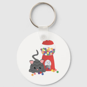 Miezekatze, die mit Gumballs spielt Schlüsselanhänger