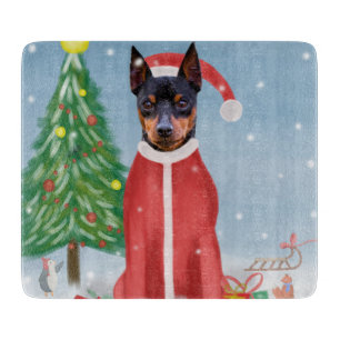 Miniatur Pinsch Hund im Schnee mit Weihnachtsgesch Schneidebrett