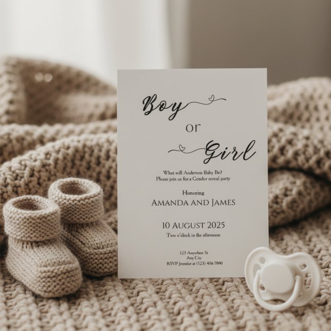 Minimalist Boy or Girl Gender Reveal Einladung (Gender reveal invitation on beige knit blanket with baby booties and pacifier in warm light)