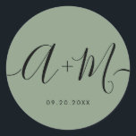 Minimalist Monogram Script Custom green Wedding Runder Aufkleber<br><div class="desc">Elevate your wedding details with the Minimalist Monogram Script Custom Wedding Date green Sticker. This elegant and personalized sticker adds a touch of sophistication to your wedding stationery, allowing you to showcase your monogram and wedding date in a simple yet impactful way. The sticker features a minimalist script design that...</div>