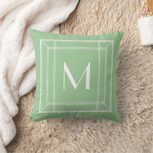 Minuszettel und weißes Monogramm Kissen