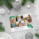 Mistletoe Twigs Foto Collage Happy Holidays Feiertagskarte<br><div class="desc">Weihnachtskarte im Foto mit einer Foto-Collage mit vier Fotos und hübschen Mistelzweigen in Grün und Blassblau. Der glückliche Urlaub ist in einem navy blauen,  charmanten Skript geschrieben. Fügen Sie Ihren Familiennamen und das Jahr in eleganten blauen Schriftart hinzu. Der Rücken weist ein passendes Misletonmuster in Weiß- und Marineblau auf.</div>