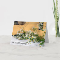 Mitleidsgitarre mit Aster-Wildblumen