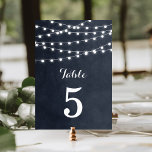 Mitternacht Blue String Lights Hochzeiten Tischnum Tischnummer<br><div class="desc">Moderne Hochzeitskartentechnik mit schlichter Tischnummer, schlichter, glänzender Saitenleuchte, die über das Oberteil hängt, und einer eleganten Mischung aus modernen und kalligraphischen Schriftart auf einem Aquarellhintergrund aus gedruckten Imitaten. Ein schlichtes und stilvolles Design, perfekt für den Sommer! Klicken Sie auf die Schaltfläche IT CUSTOMIZE, um Schriftart anzupassen, Text zu verschieben und...</div>