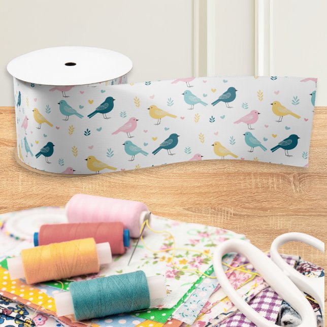 Modern Scandi Bird Pattern Ribbon Satinband (A ribbon with modern pattern of Scandi-style birds in blue, yellow and pink on a white background)