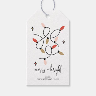 Moderne frohe und helle Weihnachtsleuchten Geschenkanhänger