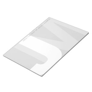 Moderne Initialen vom Schreibtisch des Notizblock