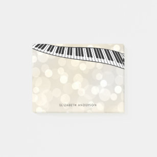 Moderne Klavier-Tastatur auf Gold Bokeh, Post-it Klebezettel