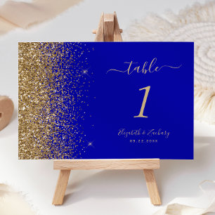 Moderne königsblaue Hochzeit mit goldener Glitter- Tischnummer