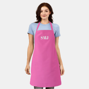Moderne Monogramm-Initialen heißen rosa weiß Schürze
