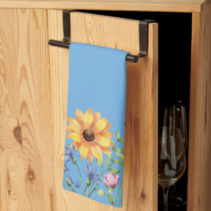 Moderne, stilvolle Wildblumen mit blauem Hintergru Geschirrtuch