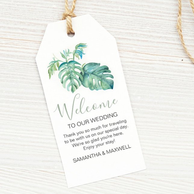 Moderne tropische Wasserfarbenwelt Willkommen Geschenkanhänger (Tropical destination wedding theme monstera palm leaf watercolor art by Victoria Grigaliunas)