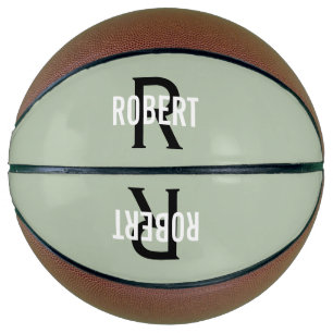 Moderner Basketball mit grün-monogramm-Bezeichnung