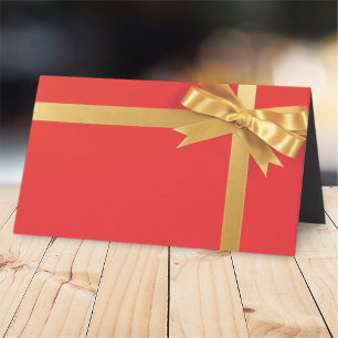 Modernes rotes Geschenk mit Golden Bow Feiertage Platzkarte