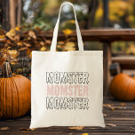 Momster Pink Halloween Niedlich & Spooky!" Tragetasche<br><div class="desc">Trage dein Halloween-Wesentliches mit unserem "Momster" Pink Halloween Tote Bag! Ideal für Mütter, die die Liebe haben, sich mit einer Touch Spaß in die Sportsaison zu begeben, bietet diese Tasche das spielerische "Momster"-Design in fett, spukhaft prägnanten Buchstaben auf einem lebhaften rosa Hintergrund. Egal, ob Sie mit den Kindern tricksen oder...</div>
