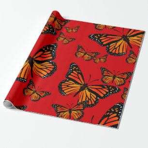 Monarch Butterfliegen auf Rot Geschenkpapier
