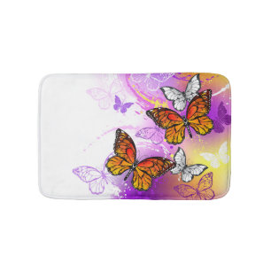 Monarch Butterflies on Purple Background Badematte