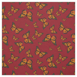 Monarch Butterfly-Muster auf dunkelrotem Hintergru Stoff