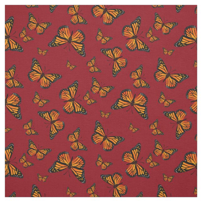 Monarch Butterfly-Muster auf dunkelrotem Hintergru Stoff (Muster)