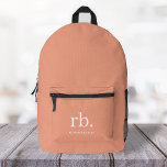 Monogram Coral Peach Elegante Feminine Minimalisti Bedruckter Rucksack<br><div class="desc">Ein minimalistisches Monogramm-Design mit großen Typografie-Initialen in einem klassischen Schriftart mit Ihrem Namen unten auf einem weiblichen Korallenpfirsichhintergrund. Das perfekt angepasste Geschenk oder Accessoire!</div>