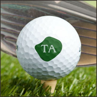 Monogramm-Anfangsbuchstaben in Grün auf dunkler Bl Golfball