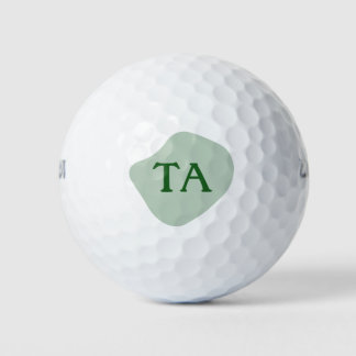 Monogramm-Anfangsbuchstaben in Grün auf farbiger B Golfball